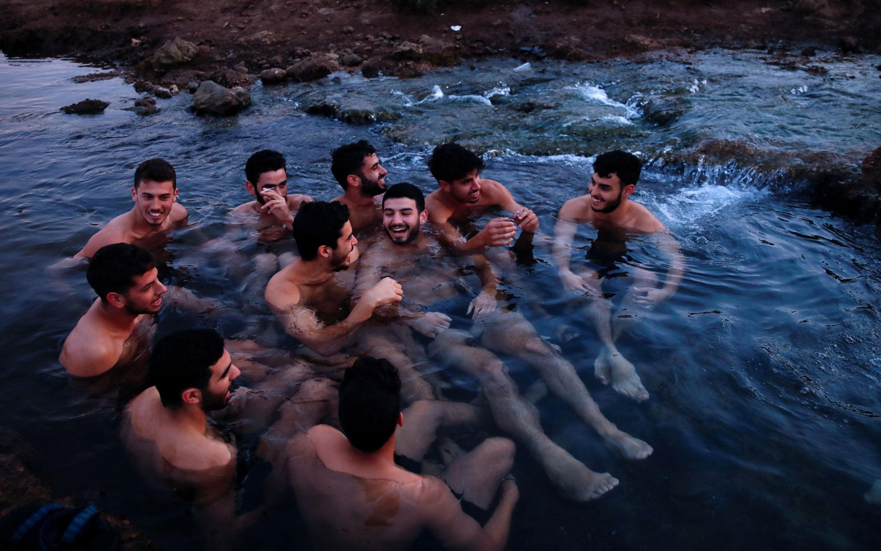 Israeli troops bathe in a Golan Heights reservoir