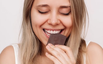 A woman eating chocolate